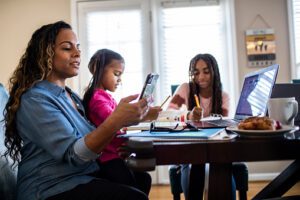 A mother and kids at the breakfast table Maryland Wellness Outpatient Mental Health